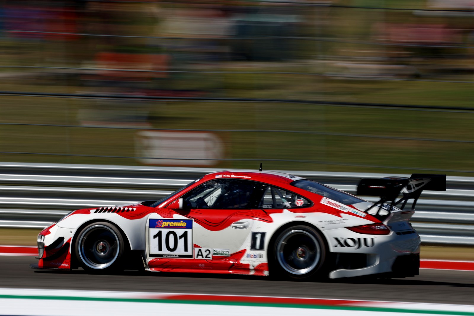 Porsche 911 GT3 R No. 101 at speed on track, Masters Endurance Legends COTA 2022